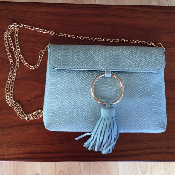 Anthropologie Handbags - ANTHROPOLOGIE Ring Embossed Leather Tassel Clutch